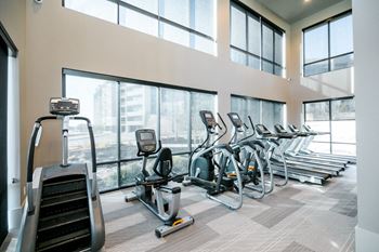 Two-story fitness center with cardio resistance and free weights